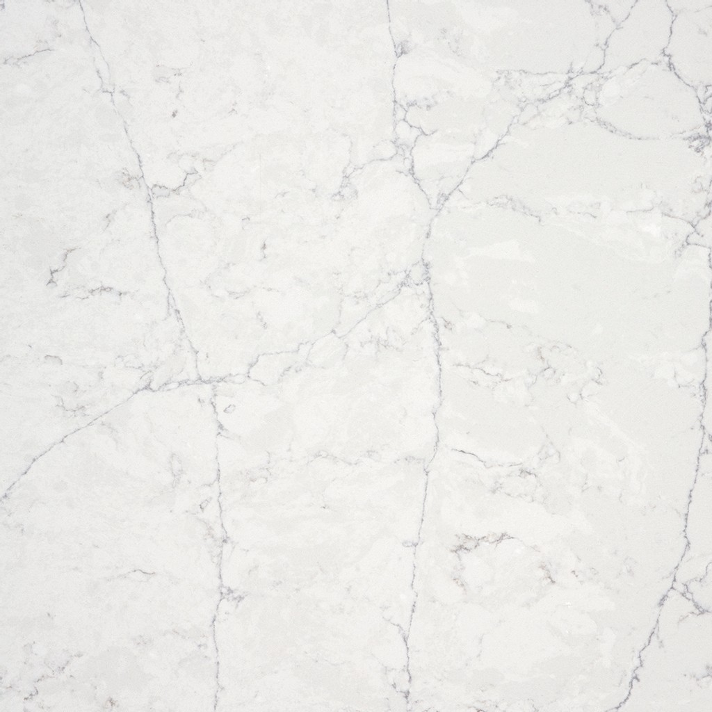 a pearl jasmine quartz countertop surface that has a dark gray veining pattern over the white and light gray background