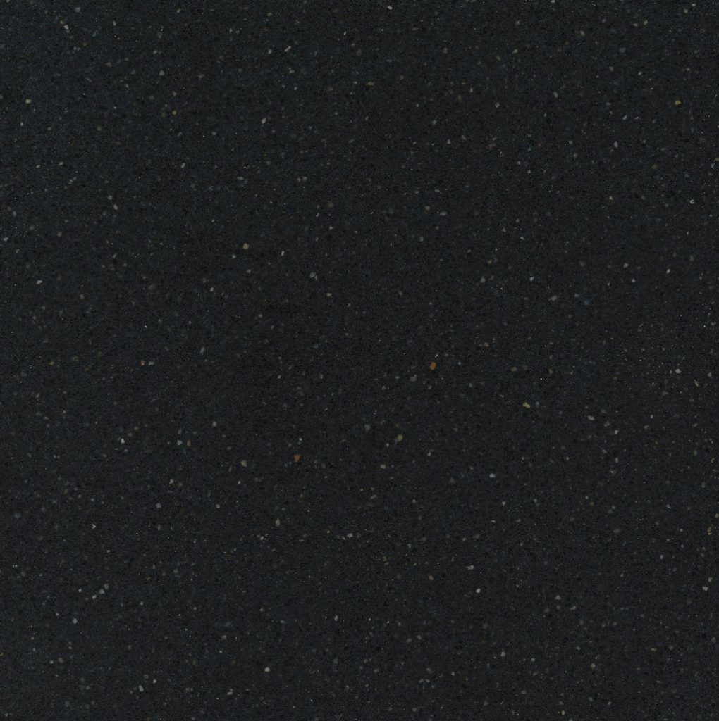 a Negro Tebas quartz countertop surface that has white speckling pattern throughout the black background