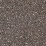 a mountain mist quartz countertop surface that has a brown color and pebble-like pattern in gray, brown, and black