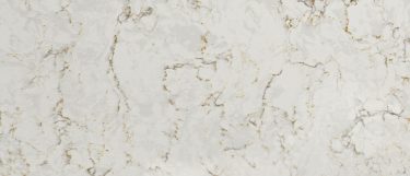 a Lusso quartz countertop surface that features veining in charcoal, beige, and bronze over the creamy white background