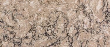 a Kimbler Mist quartz countertop surface that features brown veining over the cream colored base