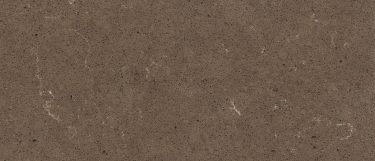an Ironbark quartz countertop surface that has a chocolate brown base color with flecks of charcoal, beige, white, cream, brown, and gray