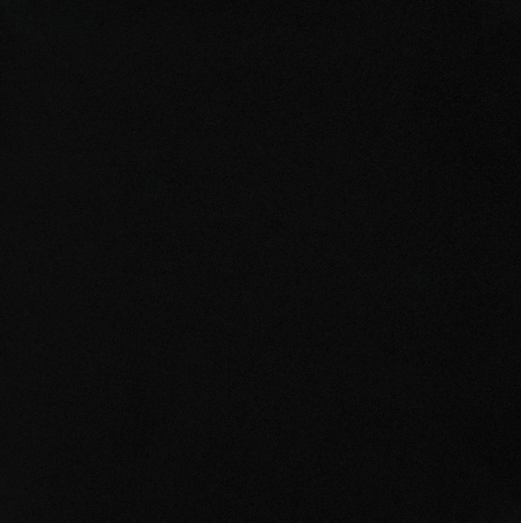 an Iconic Black quartz countertop surface that has a solid black color