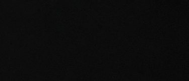 an Iconic Black quartz countertop surface that has a solid black color