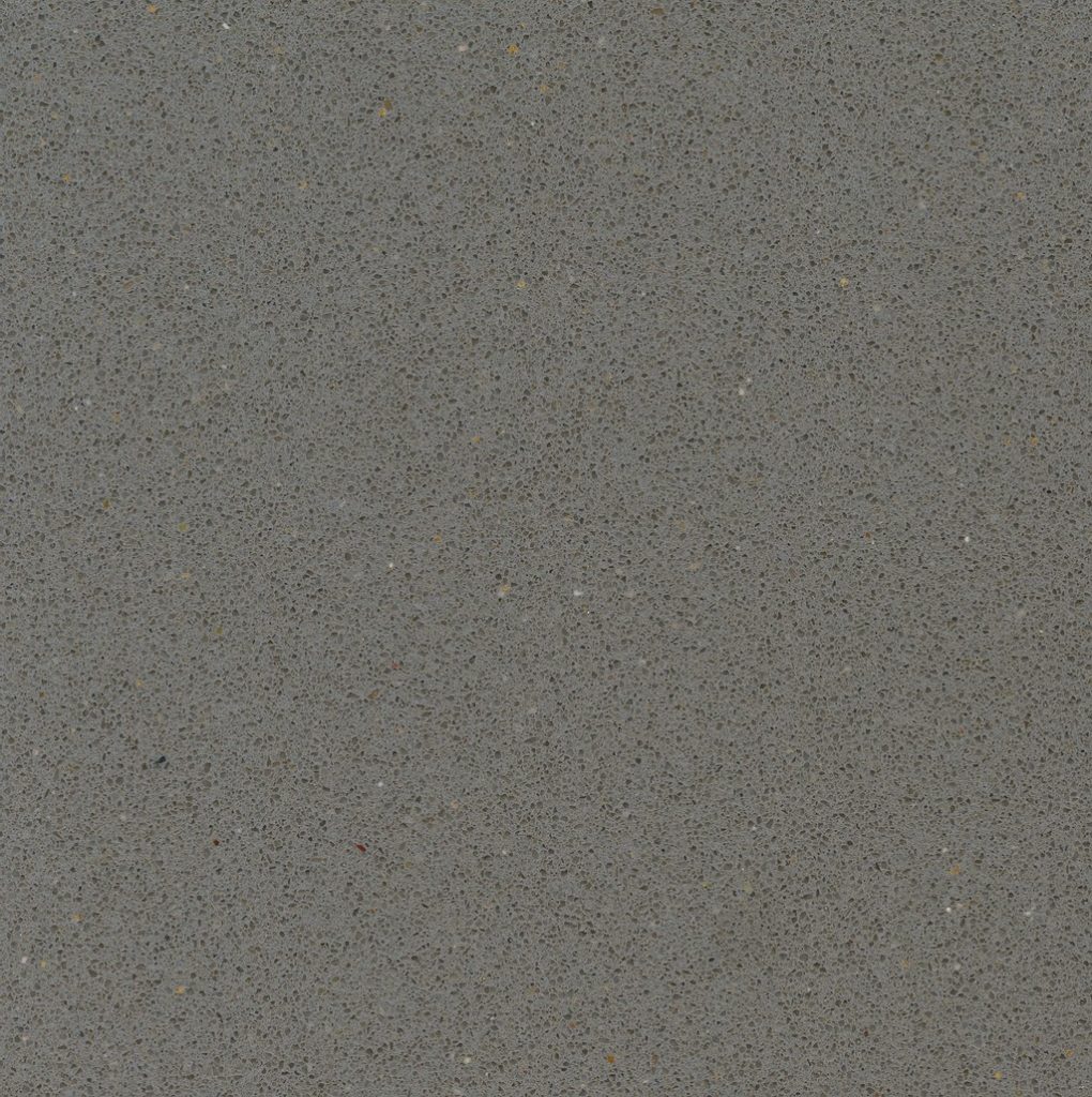 a Gris Expo quartz countertop surface that has a grainy design in cool gray color