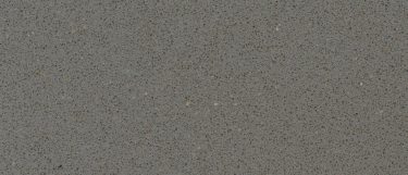 a Gris Expo quartz countertop surface that has a grainy design in cool gray color