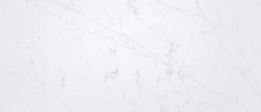an Eternal Statuario quartz countertop surface that has a white surface with soft highlight details in gray
