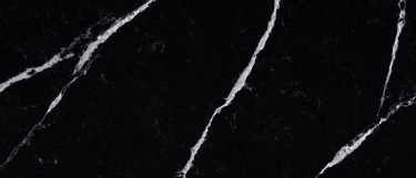 an Et Marquina quartz countertop surface that has white vein details over the black background