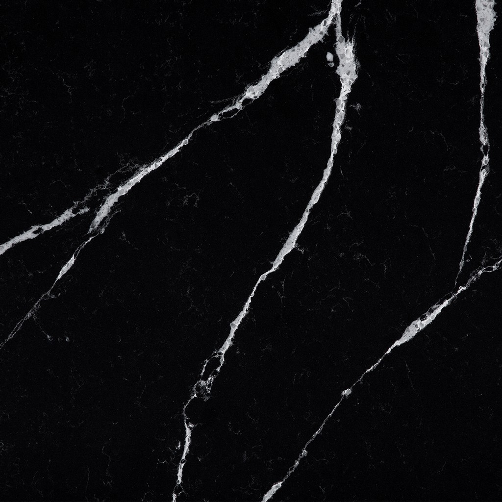 an Et Marquina quartz countertop surface that has white vein details over the black background