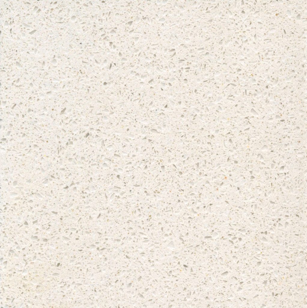 a Blanco Maple quartz countertop surface that features speckling pattern in gray over the silky cream background