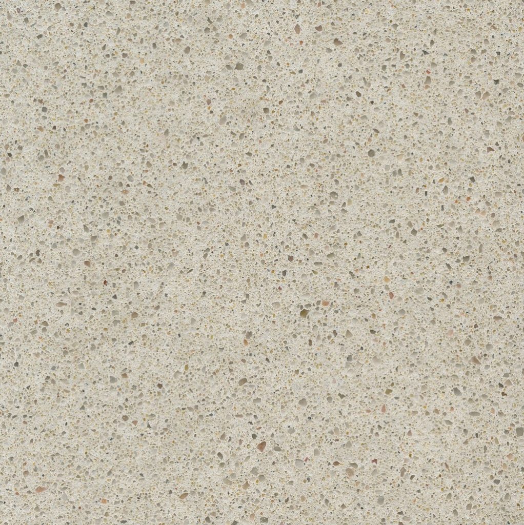 a Blanco City quartz countertop surface that features speckling patterns of brown, beige, and gray over the creamy beige base