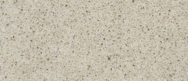 a Blanco City quartz countertop surface that features speckling patterns of brown, beige, and gray over the creamy beige base