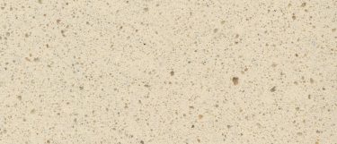 a Blanco Capri quartz countertop surface that has a beige color dotted in black, gray, and yellow specks