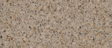a toasted almond quartz countertop surface that has a warm cream beige base and speckles of gray