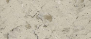 a Romano white countertop surface that has warm veining and specks pattern in white and gray tones