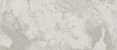 a pelican white quartz countertop surface that features light gray waves and dark details over the white background