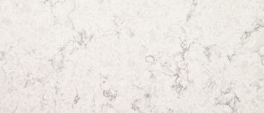 a Mara Blanca quartz countertop surface that has a creamy white background with gray veining
