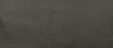 a Manhattan Gray quartz countertop surface that features a soothing gray background with subtle dark specks