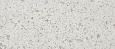 an Iced White quartz countertop surface that features snowy white color with specks of gray and white