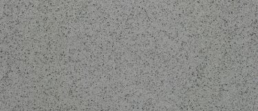 an Iced Gray quartz countertop surface that has specks over the smoky gray background