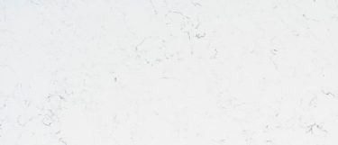 a Carrara Marmi quartz countertop surface that features subtle gray veins over the bright white background