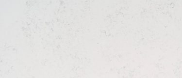 a Calacatta Vicenza quartz countertop surface that has subtle gray veins over the white background