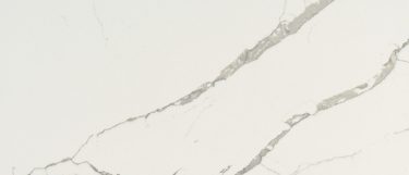 a Calacatta Laza quartz countertop surface that has soft brown veining over the milky white background