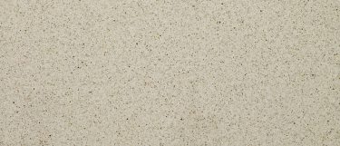 a Bayshore Sand quartz countertop surface that features flecks of cream and chocolate brown over the light beige background