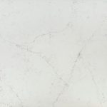 an Alabaster White quartz countertop surface that features long gray veins over the soft white background