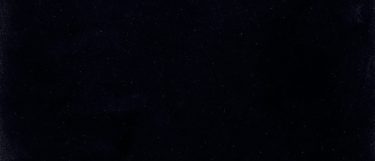 a Meteor Shower quartz countertop surface that has white specks over the deep black background