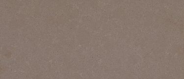 a Ludlow Tan quartz countertop that has a brown color with subtle cream veining pattern and black dotted specks all over the surface