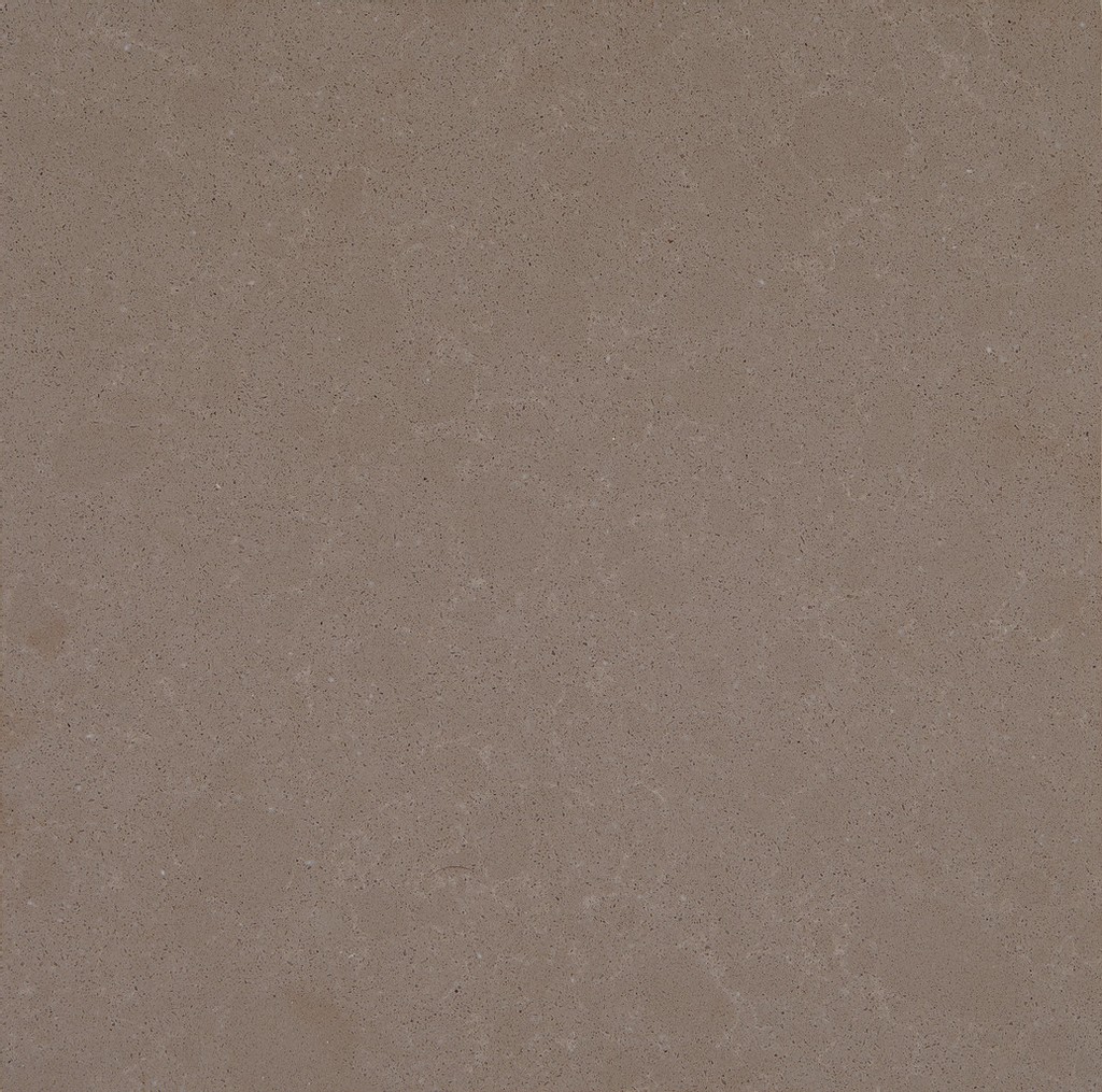 a Ludlow Tan quartz countertop that has a brown color with subtle cream veining pattern and black dotted specks all over the surface