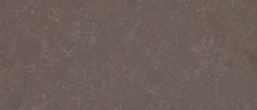 a Columbus Brown quartz countertop surface that features earth tones with subtle veining pattern