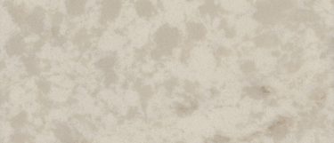 a Cararra Aura quartz countertop surface that features white and cream tones with gray striation details
