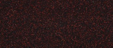 a Wilshire red quartz countertop with a red colored surface mixed with coppery browns and black specks