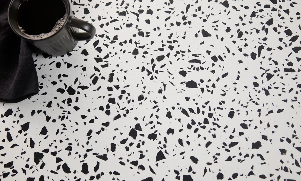 TN | Pro Stone Countertops a black coffee mug over the vail village quartz countertop surface