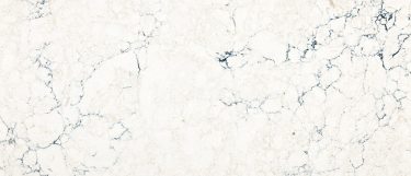 a travella quartz countertop surface that features navy blue veins on a creamy marbled background