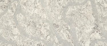 a summerhill quartz countertop surface that features large white veining patterns and several hues of white with black details