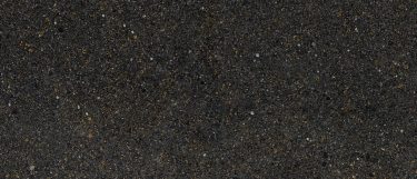 a Southampton quartz countertop surface that has warm gold tones over the dark base