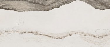 a Skara brae quartz countertop surface that has a thick wavy vein pattern in taupe green over the bone white background with light gray, white, and black speckles