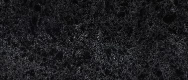 a sharpham quartz countertop surface that has white veining pattern over the dark gray to black background