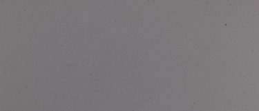 a Seattle rain quartz countertop surface that has a medium gray base flecked with darker shades of gray