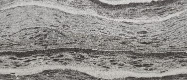 a Roxwell quartz countertop surface that blends together colors of gray, black, and cream in a wavy pattern design