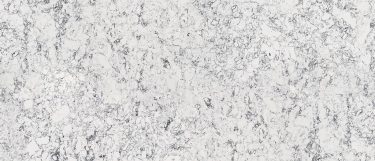 a Rosedale quartz countertop that has veining parren and intricate splashes of black and white all over its surface