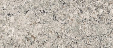 a Praa Sands quartz countertop surface that has swirling pattern in gray, black, and tan over the white base