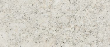 a Pendle Hill quartz countertop surface that features a light desgin with subtle veining pattern in gray and speckles in black over the creamy white base
