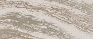 an Oakmoor quartz countertop surface that blends together colors of tan, cream, copper, and gray in a linear wavy pattern