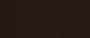 an Oakhampton quartz countertop surface that features a dark solid brown design