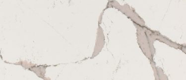 a Nadenbrook quartz countertop surface that has a veining pattern in brown khaki over the white background