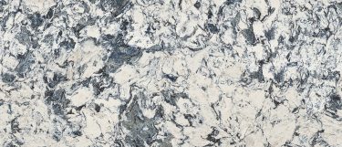 a Mayfair quartz countertop surface that features a light design with black and navy swirls over the white base